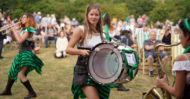 Female brass band Girlesque performing in a park at Crook.